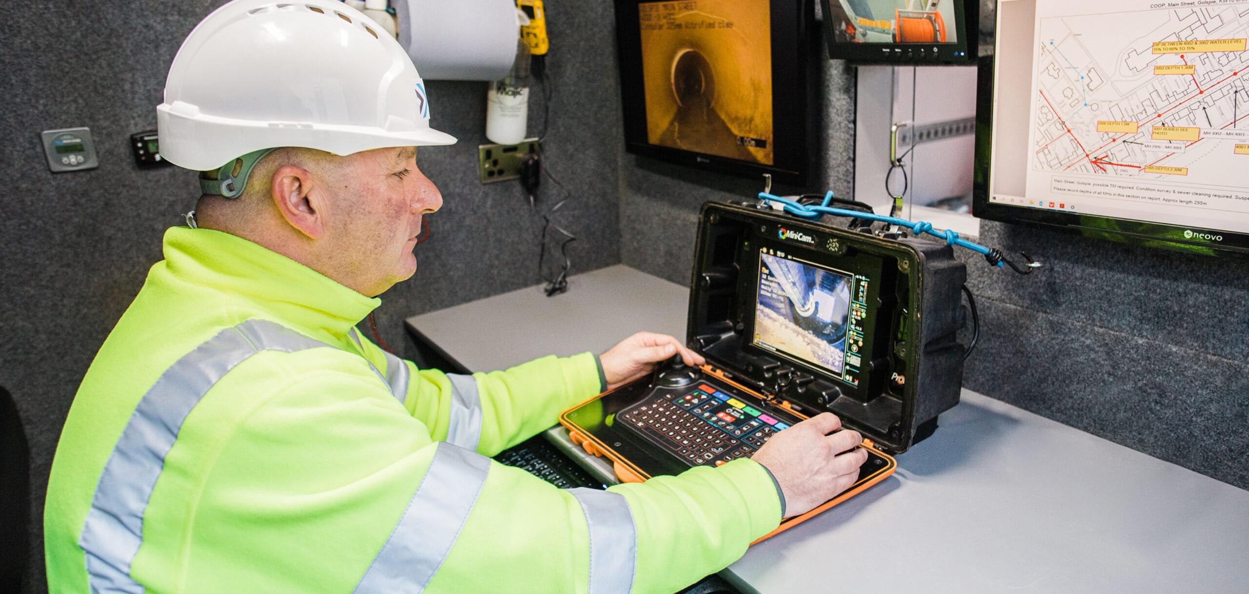 man using a mini-cam machine